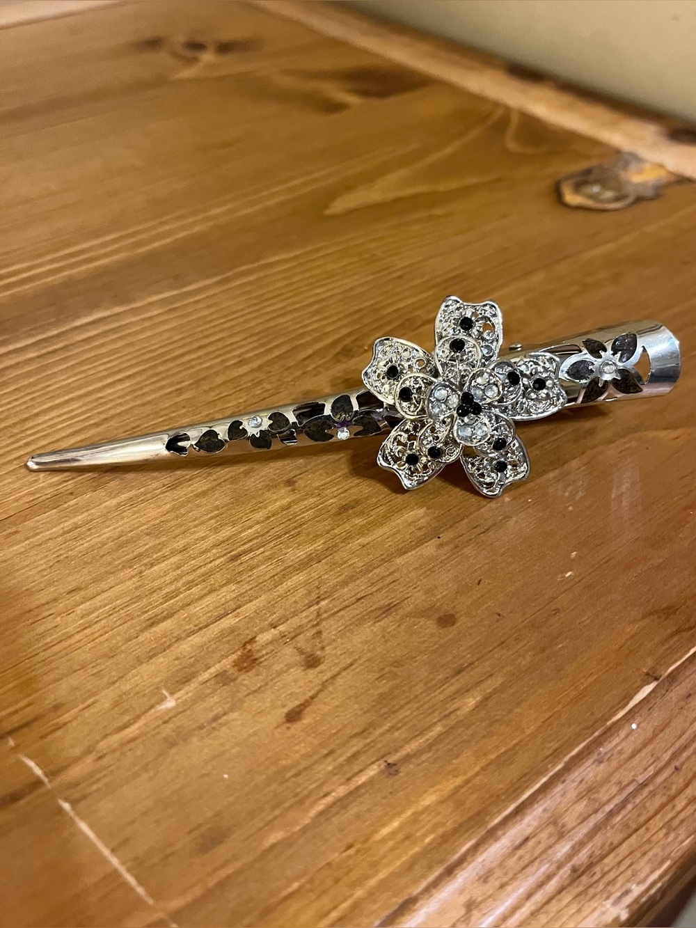 Vintage black clear rhinestone flower hair clip with intricate cut out design 5”